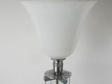 a close up of a glass lamp on a table