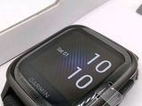 a smart watch sitting in a box on a table