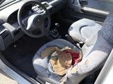 a car seat with a blanket in the back of it