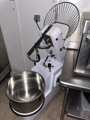an image of a kitchen with a mixer and a bowl on the counter