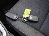 a car seat with a key and a car keychain on it