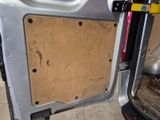 a picture of a car door with a piece of wood in it