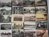 a lot of old black and white photographs on the wall