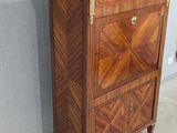 an image of a wooden cabinet with a marble top