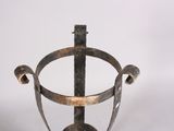 a metal vase with a handle on a white background