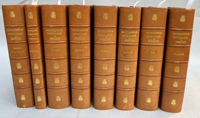 a set of six old books with gold lettering on them