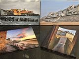 three canvass of different sizes and colors are sitting on a table