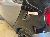 the rear end of a car with a sticker on it ' s bumper