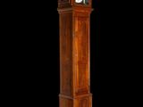 a tall wooden grandfather clock that is standing in the dark