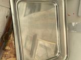 a silver tray with a mirror on top of a counter