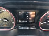 the dashboard of a car with a clock and gauges on it