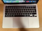 an apple macbook pro laptop computer sitting on top of a wooden table
