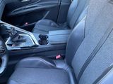 the interior of a car with black leather seats and a steering wheel