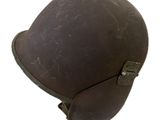 an old brown helmet with a leather strap on a white background