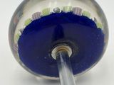 an image of a blue glass ball with a metal handle