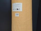a large roll of brown paper on a wooden table