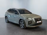 a silver suv parked in a room with a white wall