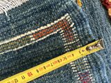an old pair of jeans with a measuring tape on top of them