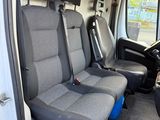 four seats in the back of a van with a steering wheel