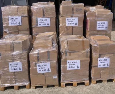 several stacks of boxes are stacked on top of each other on a pallet