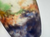 a close up of a colorful vase on a table