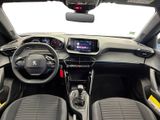 the interior of a small car with a steering wheel and dashboard