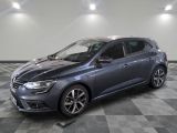 a grey car is parked on a checkered floor in a garage