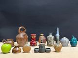 a lot of vases that are sitting on a table