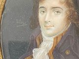 portrait of a man in a blue coat with a gold frame