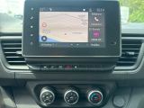the dashboard of a car with a gps device in the center