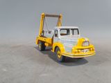 a toy truck with a crane on the back of it
