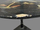 a black table with a bird design on it