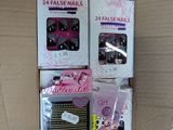 boxes of nail polish and false nails are stacked on top of each other