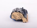 a small figurine of a man with a hat on