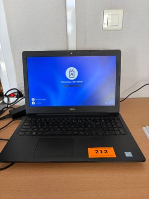 a laptop that is sitting on a desk with a mouse
