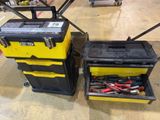 two yellow and black tool boxes with tools in them