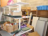 many boxes and boxes on a shelf in a room