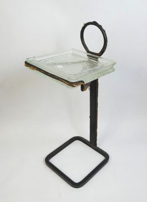 an image of a glass tray with a handle on a metal stand