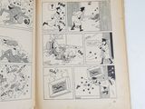 an old comic book open to a page of comics
