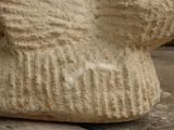 a close up of a stone statue of a bear