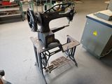a sewing machine that is sitting in the middle of a room