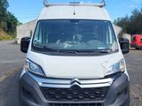 the white van is parked in a parking lot with other vehicles