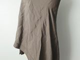 a close up of a brown shawl on a mannequin stand