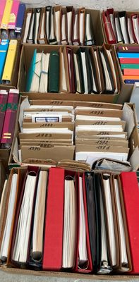 many boxes of books on the floor of this room
