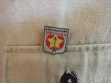 a badge on the back of a man ' s shirt