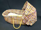 an image of a wicker basket with a blanket inside of it