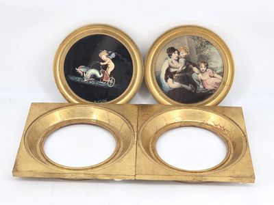 two gold plate holders with pictures of a woman and a child on them