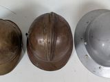 three helmets that are sitting on a table