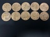 a close up of a bunch of coins sitting on top of a table