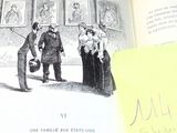 un livre ouvert sur lequel figure le dessin d'un homme et d'une femme debout devant un tableau